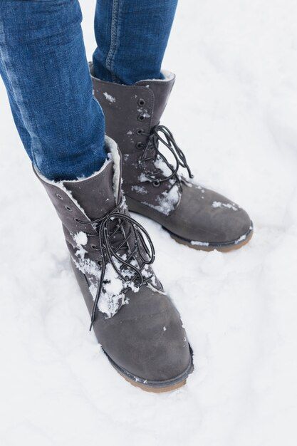 low-section-woman-standing-with-winter-boots-snow_23-2148048914.jpg